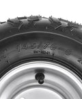 Close-up of Set Of 4 ATV Go Kart Tires 145/70-6 with 6 inch wheels, showing detailed tread and metal rim design.
