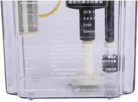 Close-up of 110V Auto Lube Pump With Digital Control And Dual Displays Plus Pressure Gauge, showing reservoir markings.