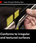 Person applying Heavy-Duty Automotive Molding Tape 7/8 Inch Wide By 15 Feet, Double-Sided Foam Adhesive For Slapping On Trim, Moldings And Emblems on a vehicle.