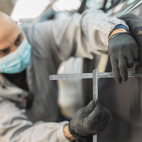 Mechanic using Lead Alloy Solder Rods For Car Body Repair 30 70 Tin Lead, Auto Brass Welding Sticks on vehicle panel