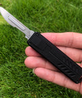 Auto retractable utility knife with push button deployment offers safe, precise cutting for opening boxes, trimming packaging.
