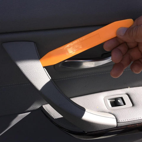 Auto Trim Removal Tool Kit Set With Four Thick Plastic Auto Clip Panel Pry Tools For Car Dash And Radio Installation in use