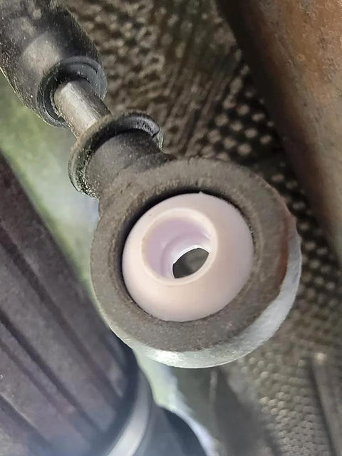 Installed view of Automatic Transmission Shift Cable Bushing Repair Kit for loose shifting fix in vehicle's gear selector linkage.