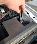 Automotive Relay Tester With Puller For 12V Cars And Trucks in use, testing car electrical system with battery clips.