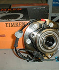 Axle Bearing And Hub Assembly With Blue Connector Passive Sensor SP500300 in Timken packaging, front view.