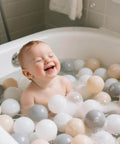 Toddler playing in bathtub with Ball Pit Balls for Toddlers Kids Plastic Balls for Ball-Pit Playpen Pool Baby Play Pastel BPA-Free Non Toxic Play