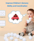 Baby playing with Ball Pit Balls for Kids, Plastic Refill 2.2 Inch Balls, 100 Pack, Bright Colors, Phthalate and BPA Free
