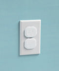 Keep curious hands safe with a 36-pack of removable, reusable electrical outlet covers installed on a standard wall outlet.