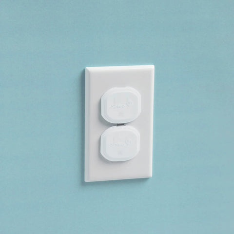 Keep curious hands safe with a 36-pack of removable, reusable electrical outlet covers installed on a standard wall outlet.