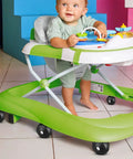Baby in green walker with 4 Pcs Baby Walker Replacement Wheels Set Quiet Wear Resistant Plastic Casters for indoor use