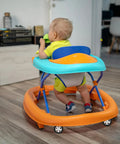 Baby using a walker with 4Pcs Baby Walker Wheels Replacement Set, Universal Removable Plastic Casters For Strollers installed.