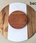 Back view of 13 Inch Marble And Acacia Wood Lazy Susan Rotating Serving Tray showing wooden frame with natural marble top.