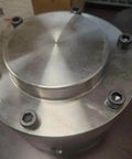 Front view of the Workhorse Backstop J4507 For Mechanical Power Transmission And Industrial Automation With Smooth Operation And Ball And Roller Bearing Tapered Design For Easy Installation And Maintenance Rexnord Falk, metal unit with screws.