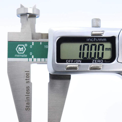 Close-up of digital caliper measuring 10x15x4mm ball bearing from the 6700 2RS blue rubber sealed ABEC 3 high precision chrome steel set