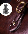 4mm Ball Head Stud Rivets Set With Screw Back 50 Pack shown with leather handbag, metallic black zinc alloy, suitable for belts and accessories