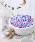 Ball Pit Balls - 100pcs - Crush Proof Plastic Children's Toy Balls Macaron Ocean Balls for Birthday Christmas Parties Games Pool in a round pit with a teddy bear
