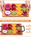 Hands holding a fruit tray with sliced fruit and handles; 8 Pack Matte Black Cutting Board And Cabinet Hardware Handles on sides.