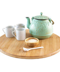 14 inch bamboo lazy susan organizer designed for cabinets and pantries, round bamboo turntable serving tea and cups.
