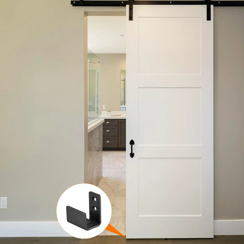 Floor Guide For Sliding Barn Doors Two Pack In Carbon Steel With Flexible Adjustable U Bracket And Flush Bottom Mount Flat Swing Stopper Black Finish Easy Install For Durable Track Alignment And Quiet Operation shown installed on a white door