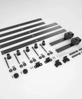 Components of a 6.6FT Barn Door Hardware Kit with Heavy Duty Modular Sliding Track, J Shaped Carbon Steel System laid out on a surface.
