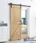 5 FT Heavy Duty Sturdy Sliding Barn Door Hardware Kit, Black on wooden door, includes handle and floor guide, fits 28-30 inch door panel.