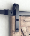 Close-up of installed 6.8FT Barn Door Hardware Kit with J Shape hanger, showcasing heavy duty alloy track and black powder coating.