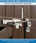 Secure, heavy duty barn door latch with cam style lock prevents unintended movement and forced entry on brown door