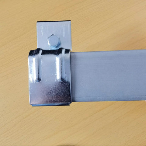 Close-up of galvanized steel heavy duty box rail hanger bracket for barn doors exterior hardware with bolt and bendable tab.