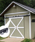 4 Wheel Trolley Assembly Rollers installed on a green shed door, showcasing smooth motion and stable alignment for electric hoist use, Black 2 Pack