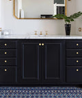 Solid Brass Brushed Gold Cabinet Knobs Set on black bathroom vanity with marble top