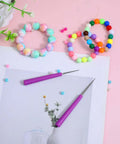 2 Pack Bead Reamer Set with Purple Handles for Jewelry Making, shown with multicolored beads on a pink background