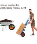 Person moving boxes using a hand truck next to a wheelbarrow, demonstrating uses for precision wheel bearings.