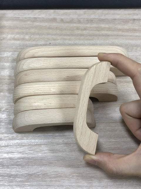 Side view of Unfinished Beech Wood Drawer Knob Set 2 Pack, showing smooth, burr-free, paintable surface and hand holding one knob