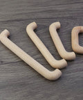 Six Pack Beech Wood Unfinished Round Arched Bridge Furniture Pulls Handles Set For Cabinets And Drawers, displayed on wooden surface
