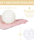 Hand holding beige 100 Ball Pit Balls Phthalate Free BPA Free Crush Proof Plastic, showcasing 2.2-inch diameter