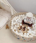 Child playing in ball pit with 100 Ball Pit Balls Phthalate Free BPA Free Crush Proof Plastic - Beige Colors in play tent.