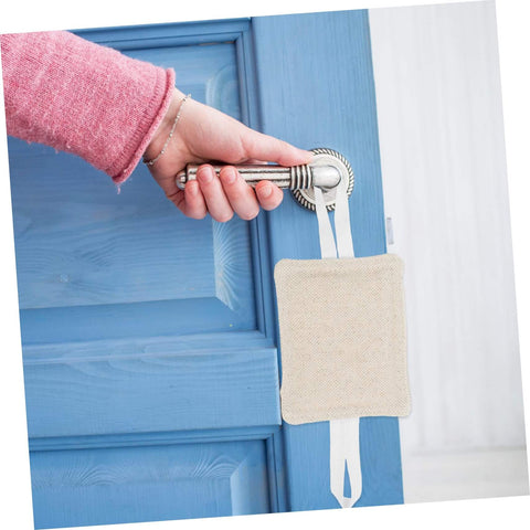 Beige door silencer installed on blue door handle, showing easy, tool-free use. Experience peaceful rooms with easy, tool-free door silencers.