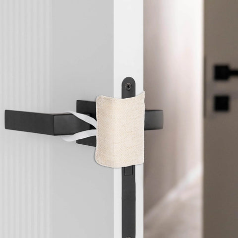 Installed beige 3 Pack Door Silencers For Slamming With Elastic Latch Covers, showing durable polyester material cutting down noise.
