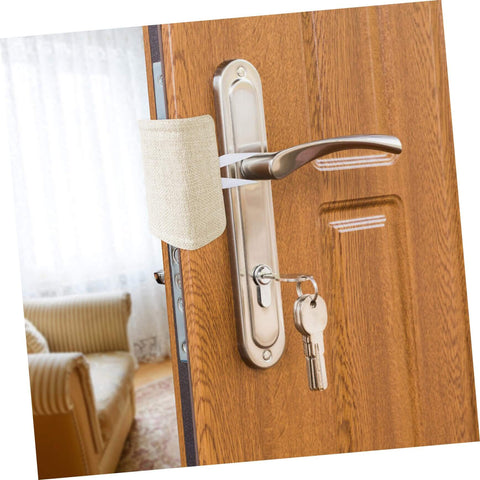 Beige door silencer installed on wood door handle, showcasing experience peaceful rooms with easy, tool-free door silencers.