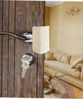 Experience quiet, safe doors with these tool-free door silencers; simply suspend on the knob to dampen slams, beige fabric shown installed.