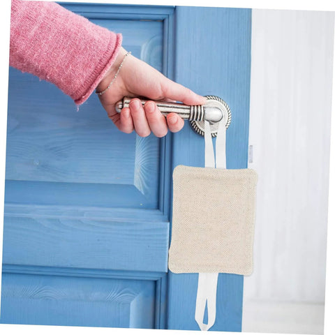 Hand holding door handle with beige cushion installed, part of 3 Piece Door Slam Stopper Set For Noise Reduction And Door Protection.