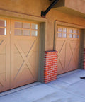 Row of brown garage doors on brick and stucco building exterior