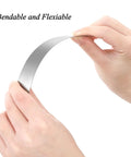 Hands bending a strip from Pro Grade 30 Piece Shim Stock Set In 304 Stainless Steel For Precise Leveling And Gap Filling On Kitchen And Home Projects