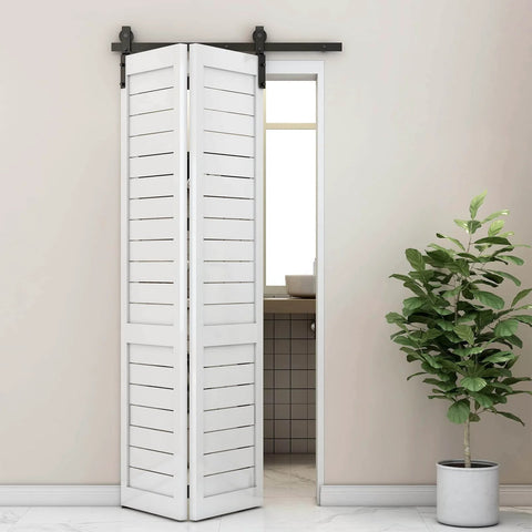 Room interior with a 36" Bi-Folding Sliding Barn Door Hardware Track Kit smoothly and quietly operating with side-mounted black rollers.