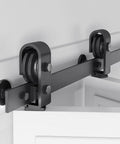 Close-up of 52 inch Bifold Barn Door Hardware Track Kit for Two 24 inch Closet Doors, Top Mount Sliding System with roller in black.