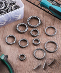 Five Sets Bike Bearing Kit With Fifty Bearings In Ten Sizes From 4mm To 8mm for mountain and road bicycles on a wooden table