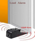 Door Stop Alarm with 120DB Siren Door Stop for Home & Travel (Black) placed under door showcasing alarm activation