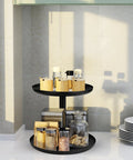 Two Tier Metal Lazy Susan Organizer Rotating Spice Rack For Kitchen Pantry And Countertop Made From 1.2mm Cold Rolled Steel With Powder Coated Finish For Moisture Resistance Smooth 360 Degree Rotation Top 9 Inch Bottom 11 Inch Diameters Black in a kitchen setting.