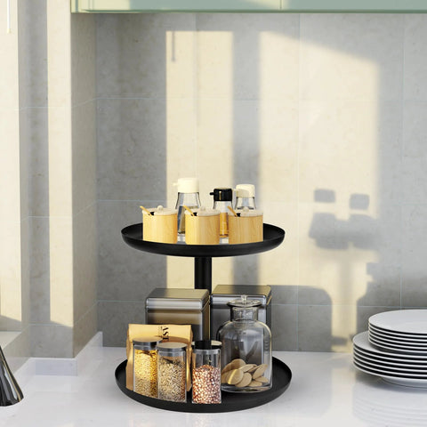 Two Tier Metal Lazy Susan Organizer Rotating Spice Rack For Kitchen Pantry And Countertop Made From 1.2mm Cold Rolled Steel With Powder Coated Finish For Moisture Resistance Smooth 360 Degree Rotation Top 9 Inch Bottom 11 Inch Diameters Black in a kitchen setting.