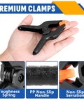 24 Pack 3.5 Inch Plastic Spring Clamps Black Heavy Duty Clips Backdrop Clips in hand, showing features like tough spring and non-slip handle.